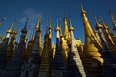 Inle Lake Myanmar. Indein, on the summit of a hill the  Shwe Inn Thein Paya a cluster of hundreds of ancient stupas. Many of them are ruined and overgrown with bushes. 